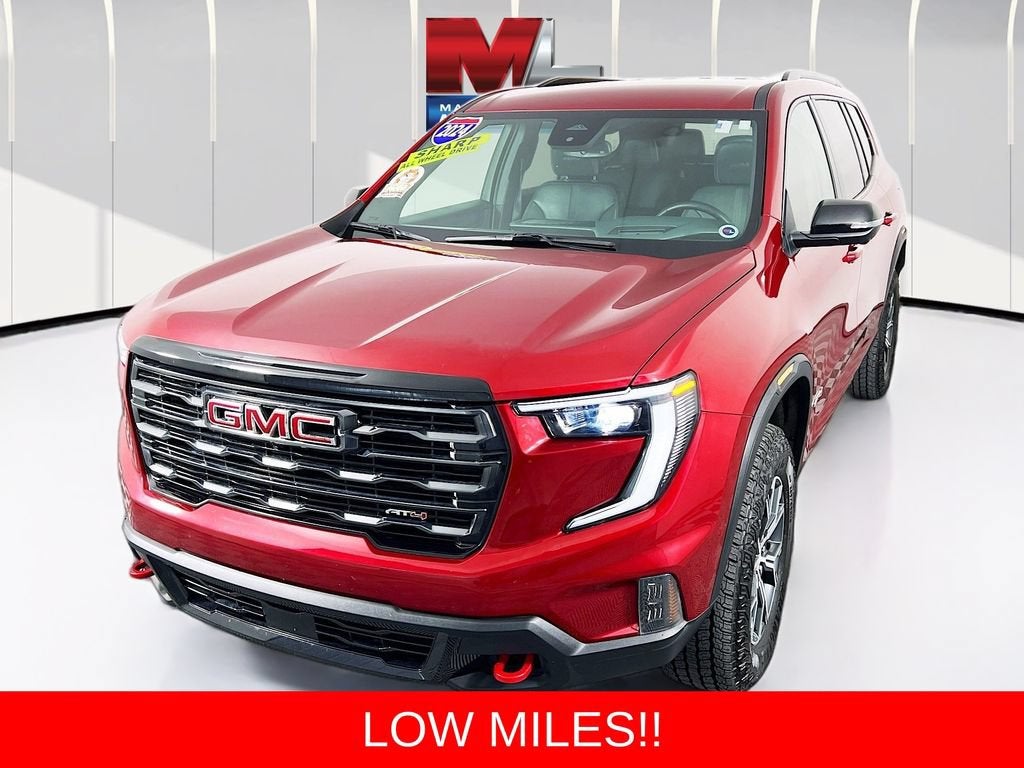 2024 GMC Acadia AT4 in Volcanic Red Tintcoat — front three-quarter view